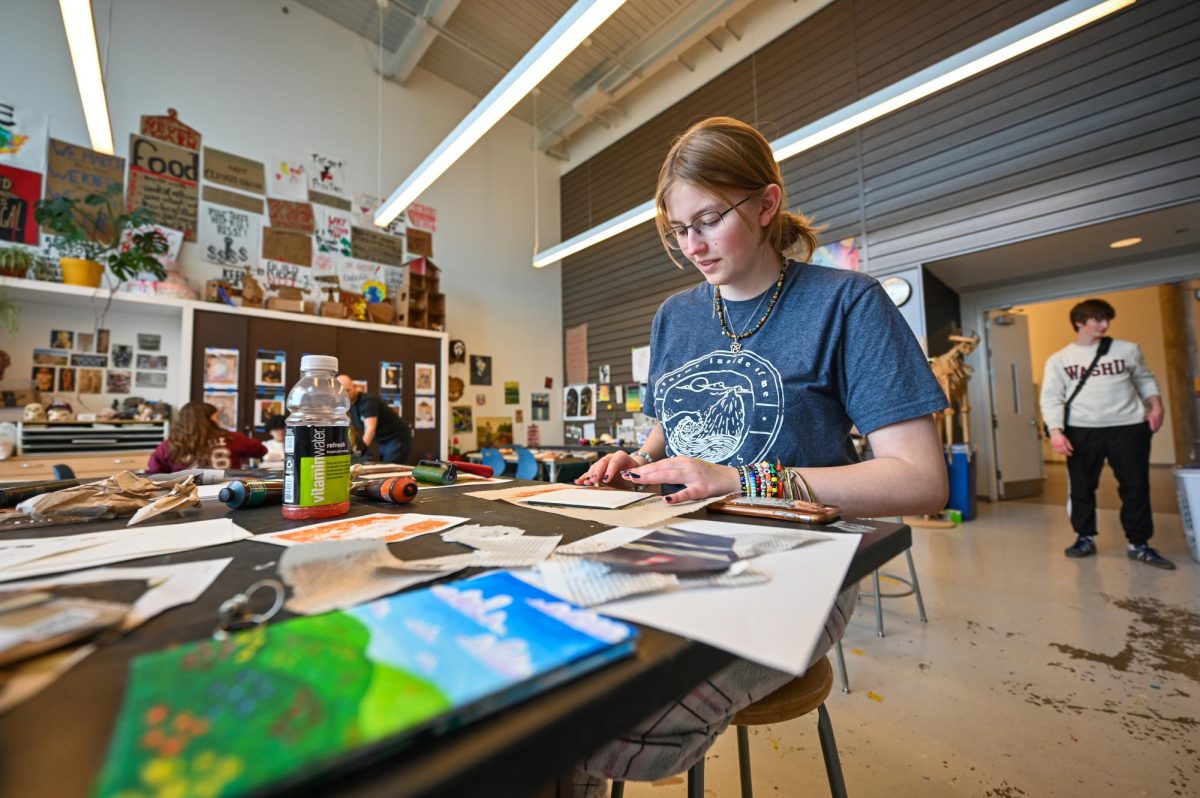 Junior Liz Longnecker completes a Gelli plate print during Period 3.