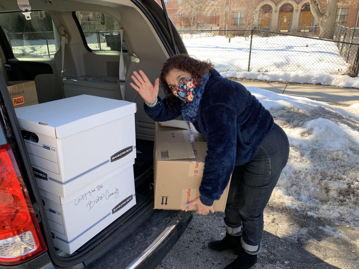 Saba Ayman-Nolley unpacks donations from the Baha'i community to be used for various social justice projects. Ms. Ayman-Nolley is the president of the Hyde Park/Kenwood Interfaith Council.