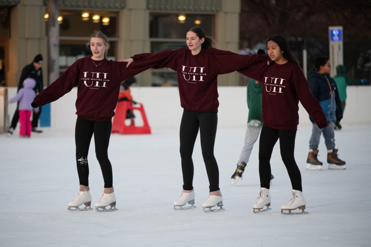 Ninth grader Tal Neiman skates alongside co-presidents of the U-High figure skating club, sophomores Lily Davidson and Hannah Gao, on the Midway Plaisance ice rink. They meet almost weekly to skate for leisure or prepare for high school skating competitions.