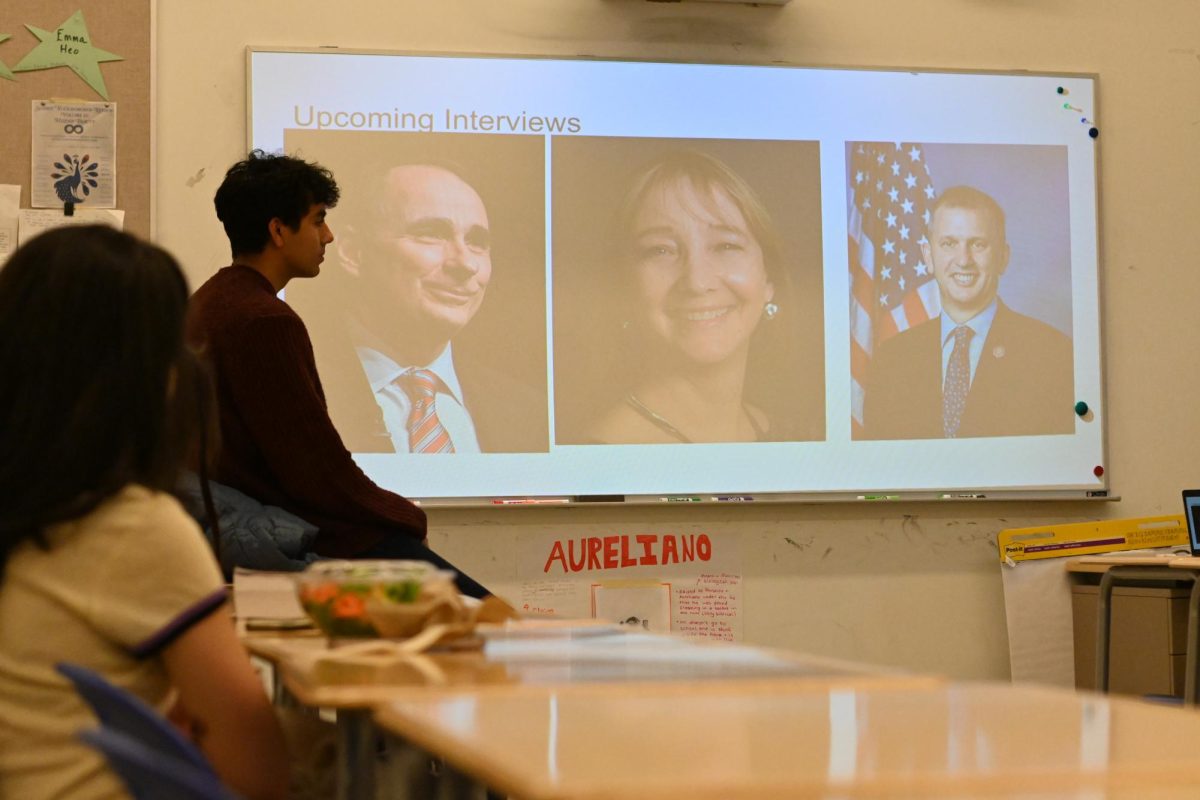 At a Jan. 31 meeting, the Youth Engagement in Politics Club announces the guests they will be interviewing. The nonpartisan club aims to be a space for students to discuss politics.