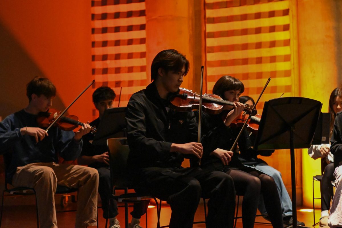 Sophomore Aiden Yu and other members of the U-High Chamber Collective perform a female-forward pop concert in Gordon Parks Arts Hall on March 5, raising funds for the Chicago Foundation for Women.