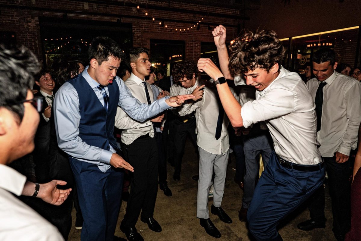 DANCE, DANCE, DANCE. Seniors Jeffrey Wang, Raza Zaidi, and Marko Nagel dance in a circle at prom. Senior Isolde Wedemeyer enjoyed the dancing at prom. “It was bittersweet having a last dance with the people I’ve known since preschool,” she said, “but it was nonetheless fun to dance with my peers.”