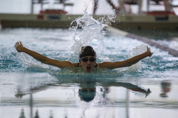 Senior Hayla Shah does the butterfly at a meet against Latin on Sept. 24.