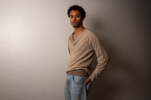 Senior Desmond Tarkowksi-Pope.L models for his mother’s “mud+acid” art collection sold online at thestainlab.com. He appreciated that it gave them time to bond and allowed him to learn more about what she loves to do.