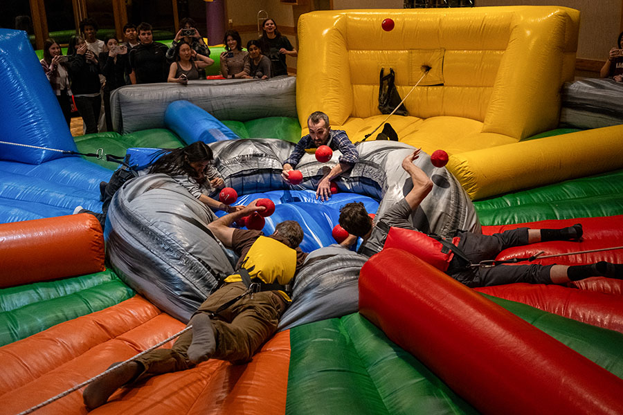JANUARY — Scrambling Madness. On the second day of Senior Retreat, Jan. 31, faculty members Sari Hernández, Kevin Nihill, Ross Hunefeld and Brian Wildeman compete in a life-size game of Hungry Hippos in the main lodge of Eagle Ridge Resort.  