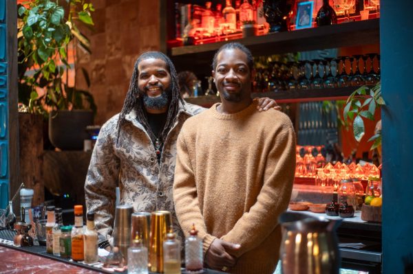 Co-founder of Hyde Park restaurant Mahari, Magic Johnson, left, smiles with executive chef Rahim Muhammad. Mahari opened in 2025 at 1504 E. 55th St.