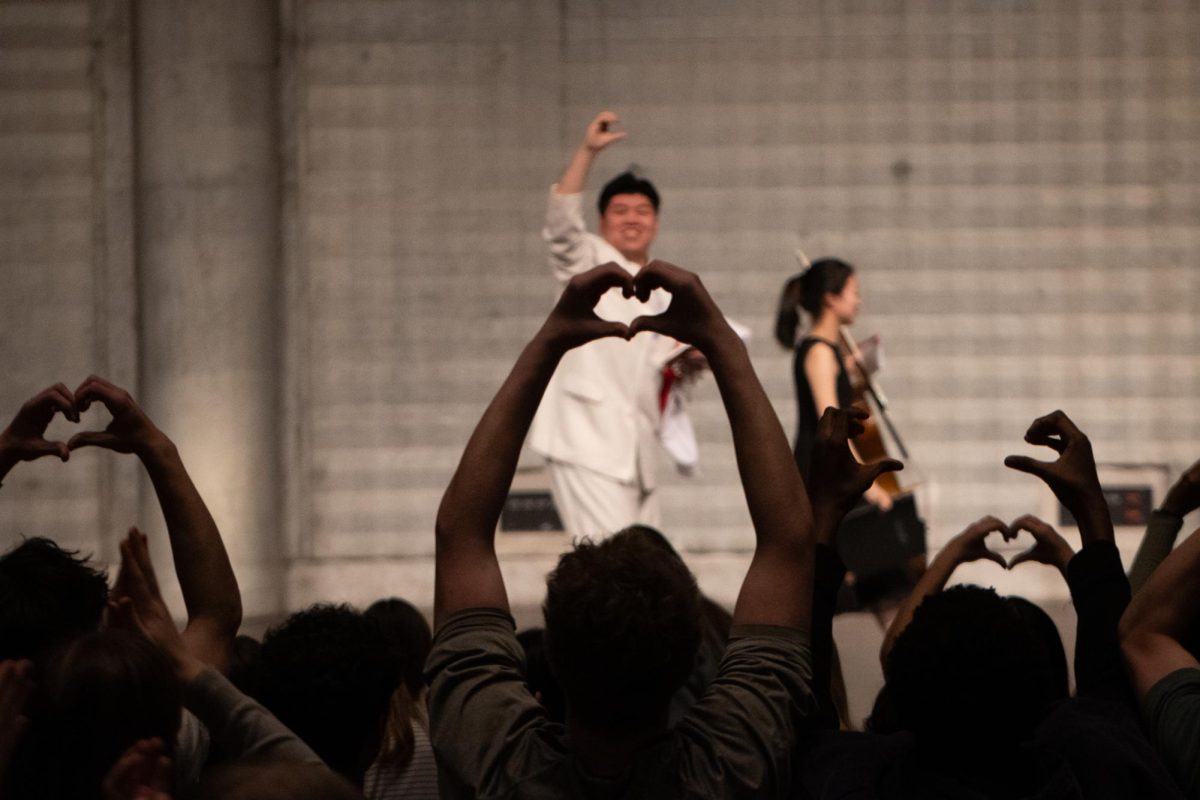 FOND FAREWELL. Students shape hearts with their hands in response to watching an RDFZ performer, an affectionate goodbye gesture following the school’s dynamic performance at the ArtsFest closing assembly.