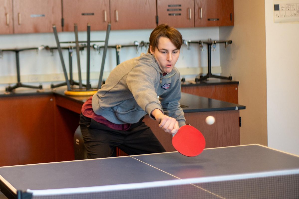 TABLETOP TENACITY. Ryan De Jong returns a serve, bouncing a ping-pong ball across a table during the Art of Ping-Pong workshop.