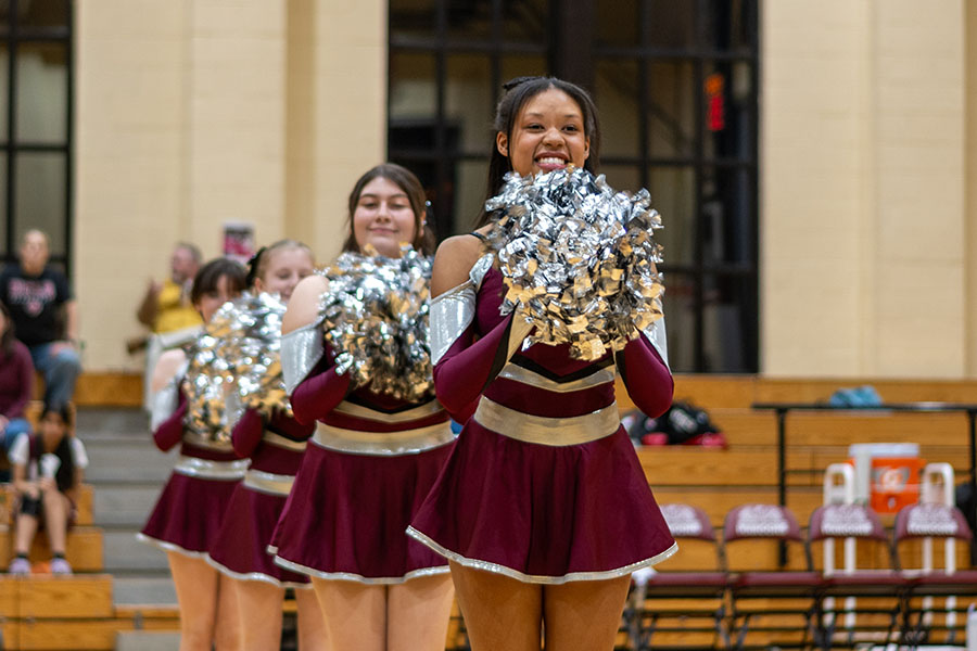 During a half-time performance on Dec. 18 at a girls basketball game, junior Nadia Washington holds her poms.