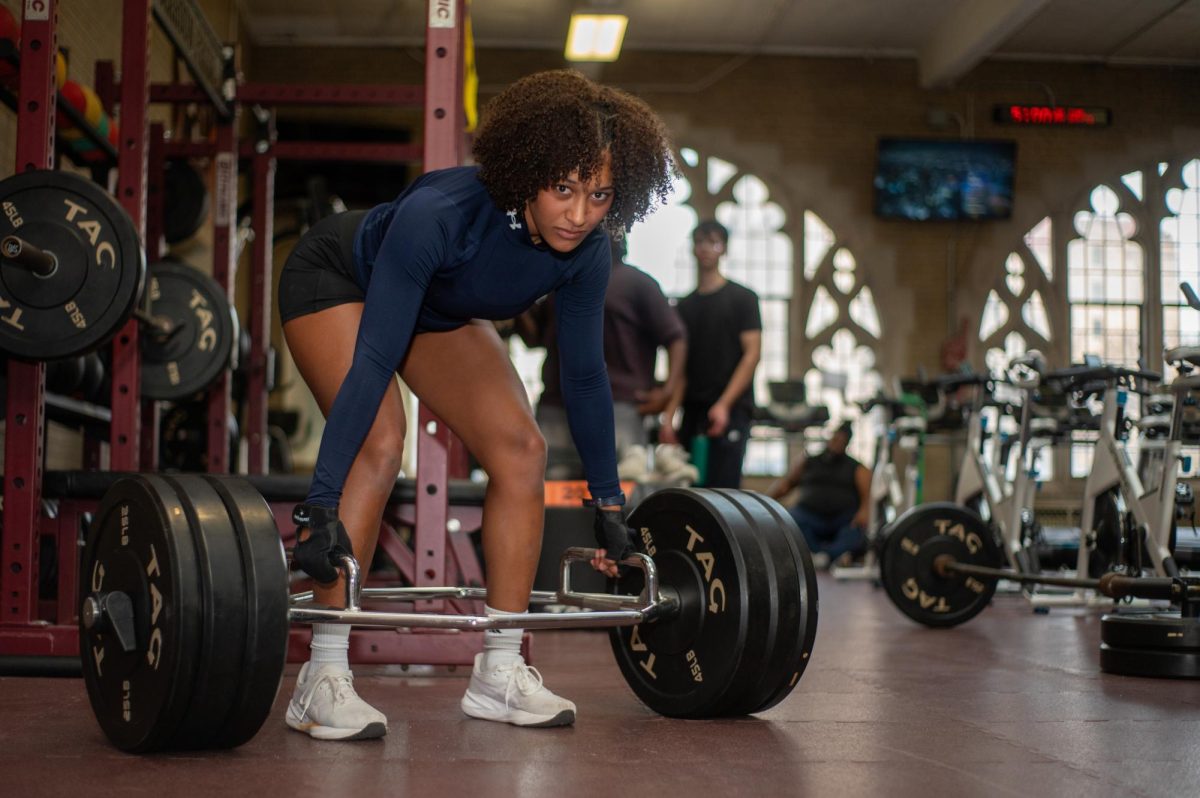 WORTH THE WEIGHT. Whether Senior Eve Dyson is deadlifting after school or training on a throwing circle at a track and field meet, Eve has adapted to self-preservation in her athletic endeavors, teaching her self-motivation, perseverance and leadership skills. 