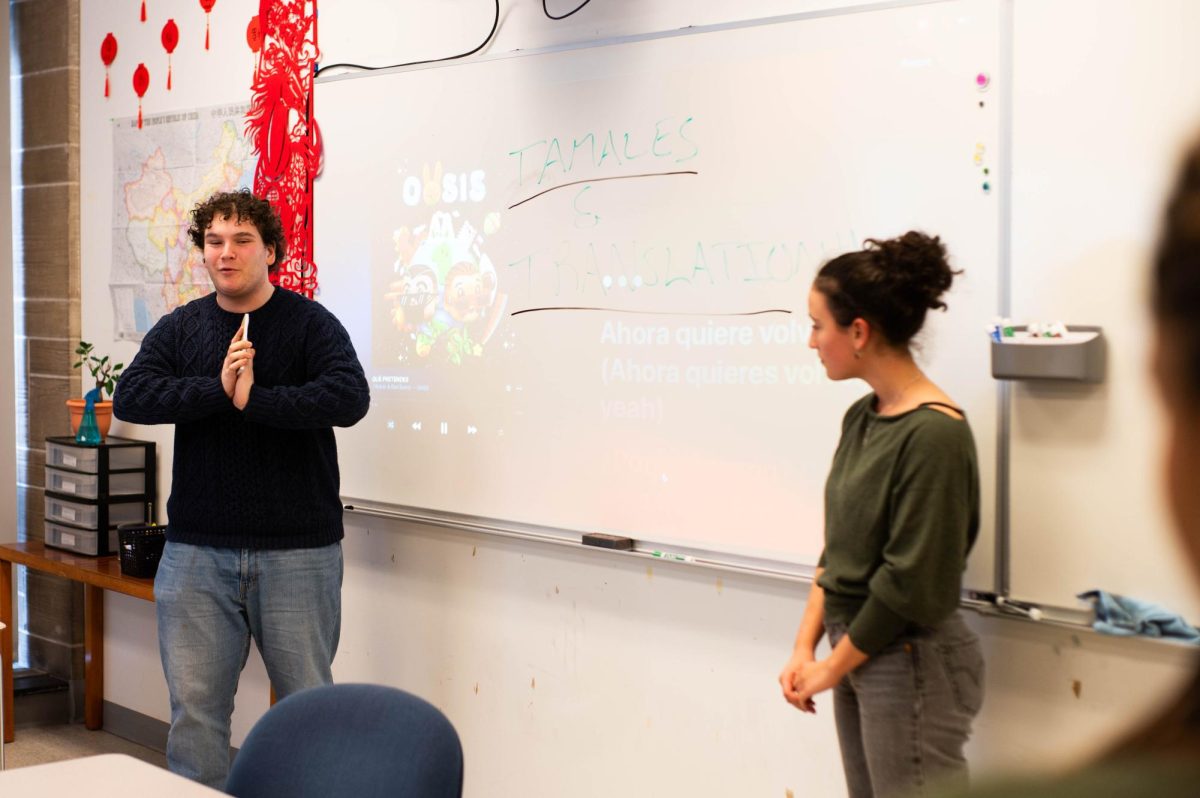 Seniors Adam Tapper and Maya Livni present during Tamales and Translation on Mar. 3 at lunch. The event was continued from last year due to its continued success. 