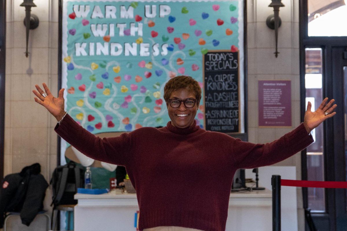 U-High counselor Camille Baughn-Cunningham poses in Blaine Hall. “My own experience as a student is what sparked that interest and really helped develop that love of learning and settings where learning is taking place,” Dr. Baughn-Cunningham said.