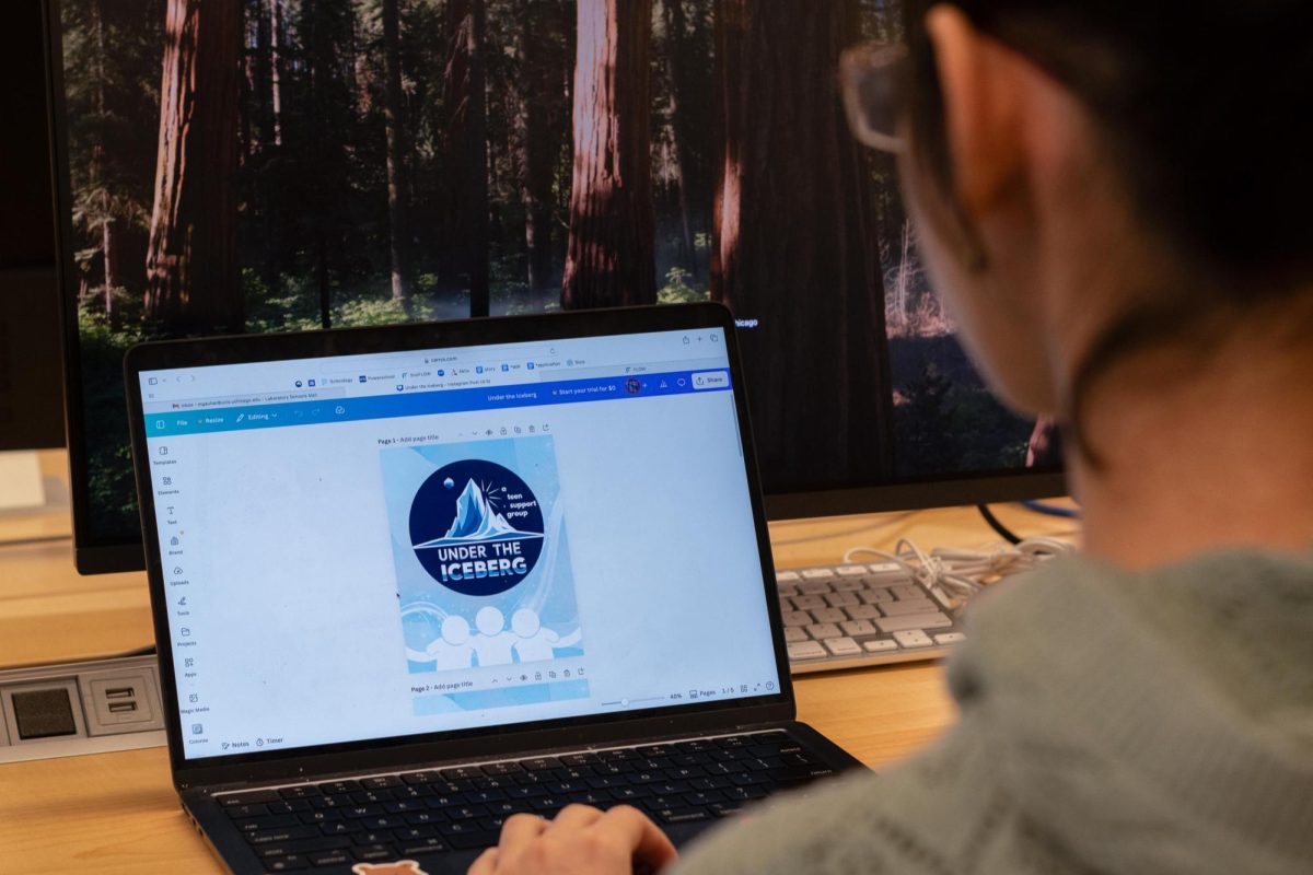 President and founder Maya Gauhar edits a poster for her organization, Under The Iceberg. Under The Iceberg is an organization connecting students with invisible illnesses, such as anxiety, scoliosis and allergies.  