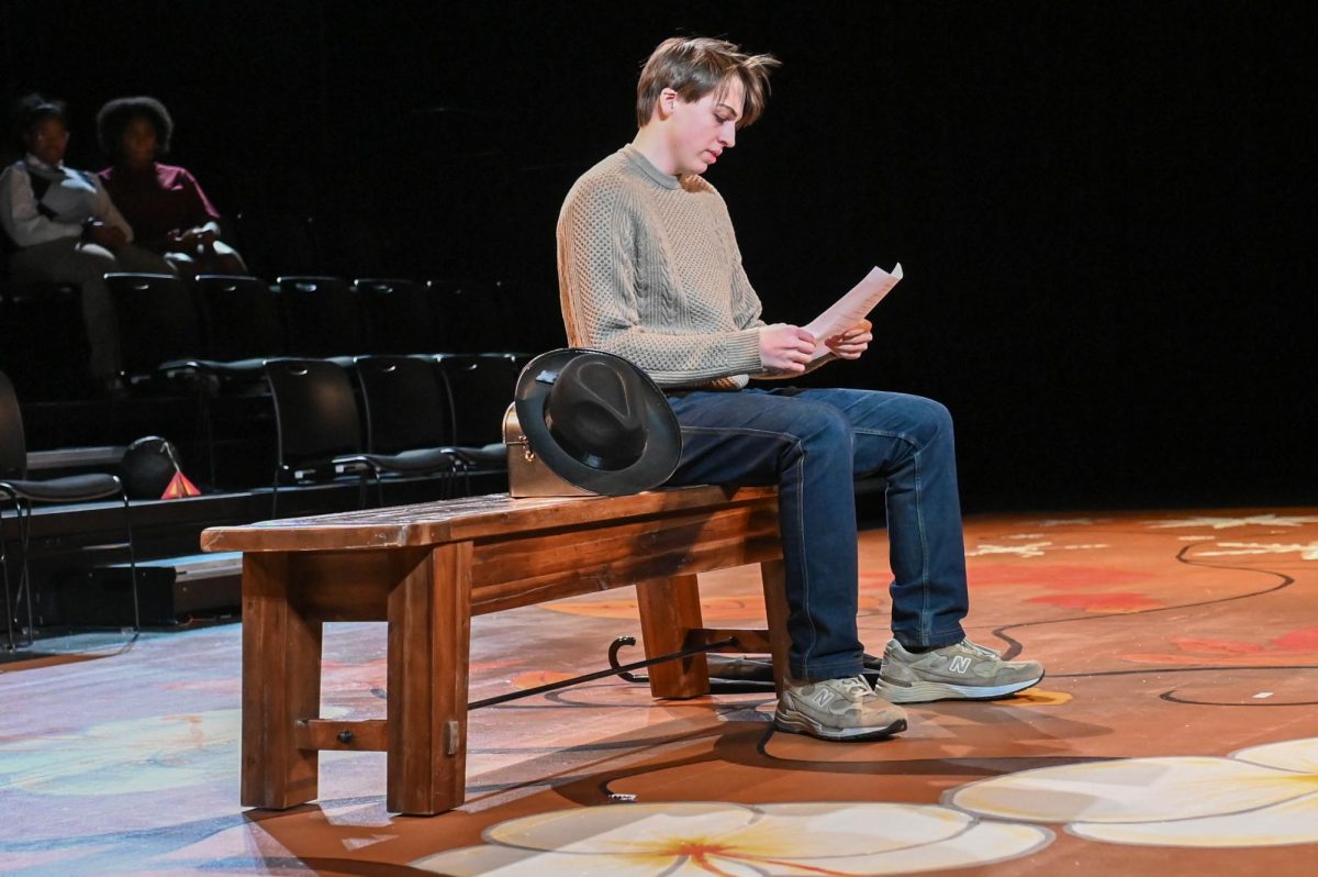SIGHT STRUGGLES. In the show on Feb. 27, while attempting to read a newspaper, Alistair MacKay-White’s character, George, squints down at the sheet before reaching for his glasses. Alistair’s scene, “The Picnic,”  was about an old man suffering from dementia, reminiscing about his time with his wife.