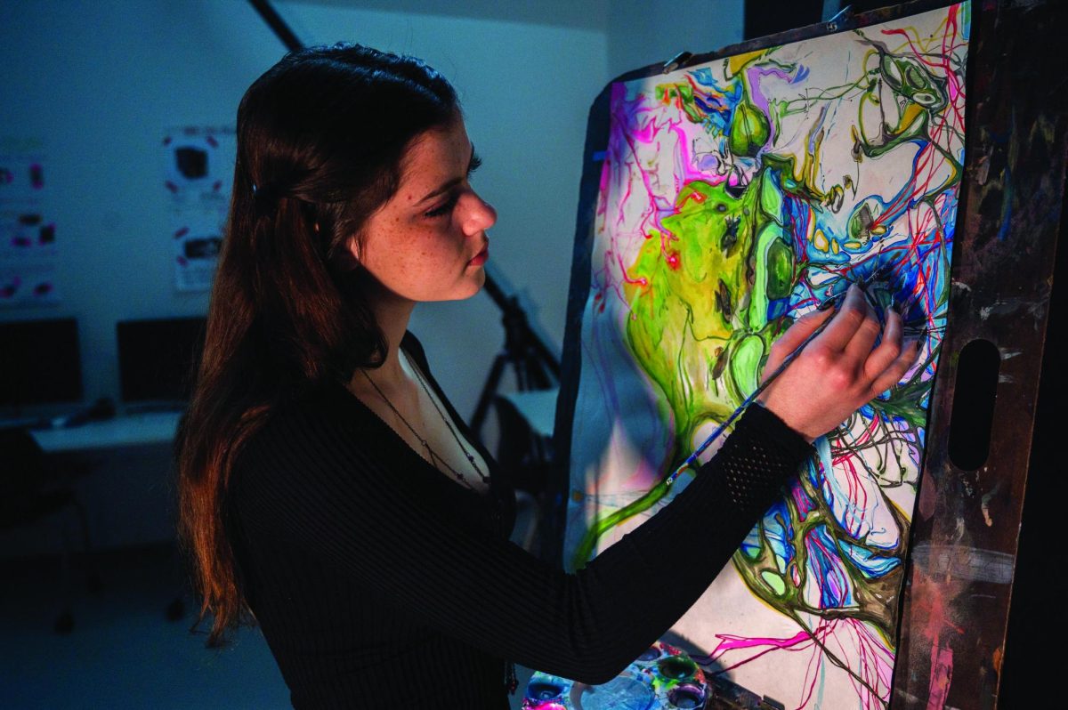 After taking a mixed media art course,  junior Laurel Farmer immersed herself back into art. She currently is using topics she learns about in her neuroscience class as a new guide for her creativity. Here she paints an oligodendrocyte, a support cell for neurons.