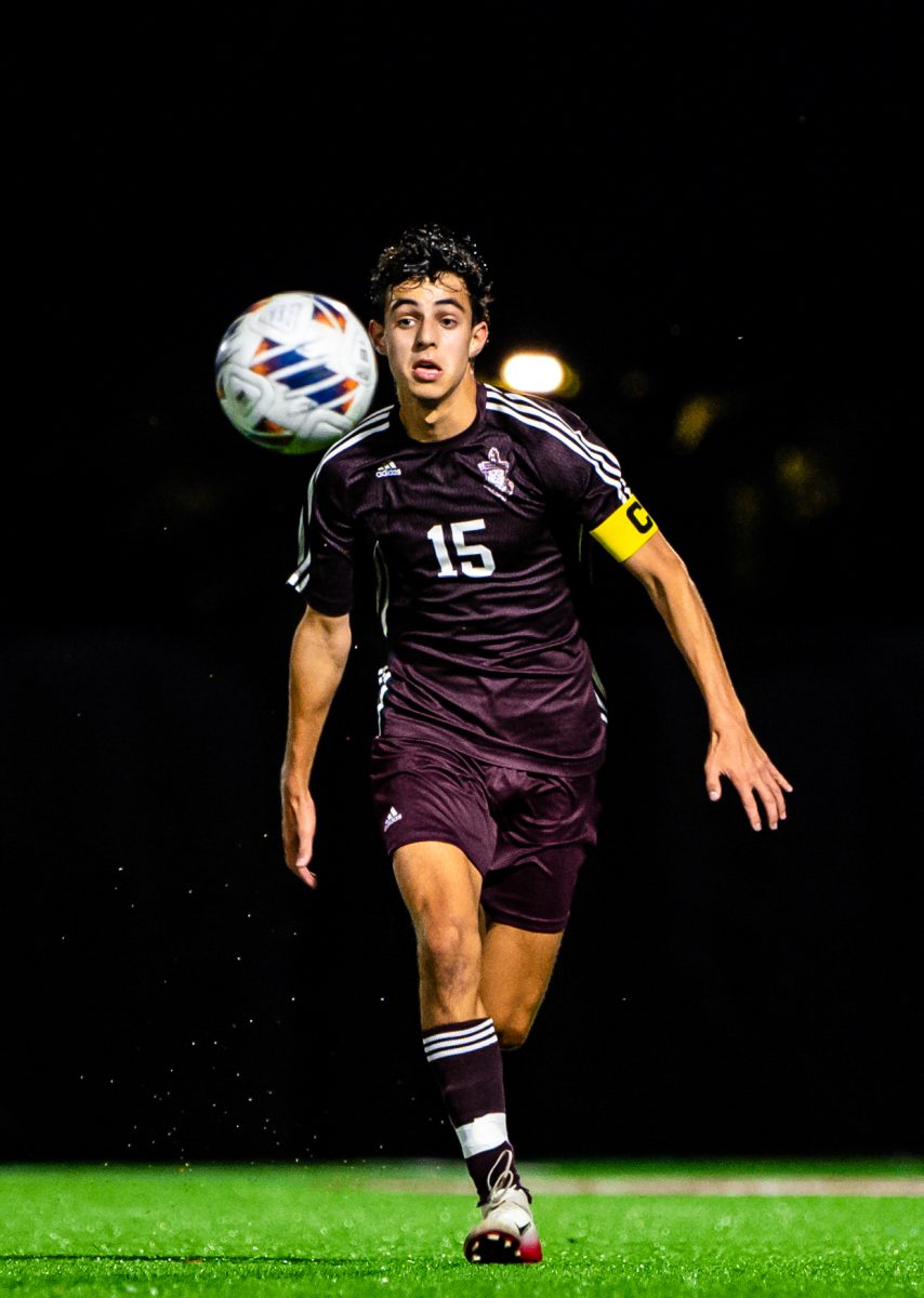 RESILIENT RACING. Chasing down the ball, senior Danny Aronsohn, a varsity boys soccer captain, makes a run during a home game against Francis W. Parker School Sept. 16. The game ended in a satisfying 2-1 win for U-High, in which Danny scored a key goal. “Winning the ISL for the first time since 2019 was special,” he said. “Having this goal made the intensity of every conference game go way up.” 