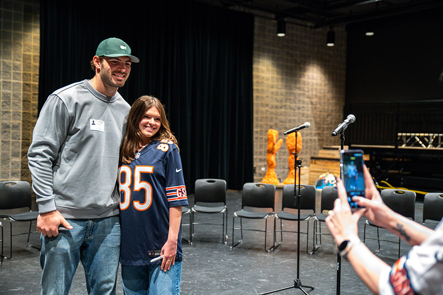 Smiling for the camera, Chicago Bears tight end Cole Kmet poses for a photo with sophomore Dorothy Jennett. Kmet was hosted by U-High's Innovators' Club earlier in April. 