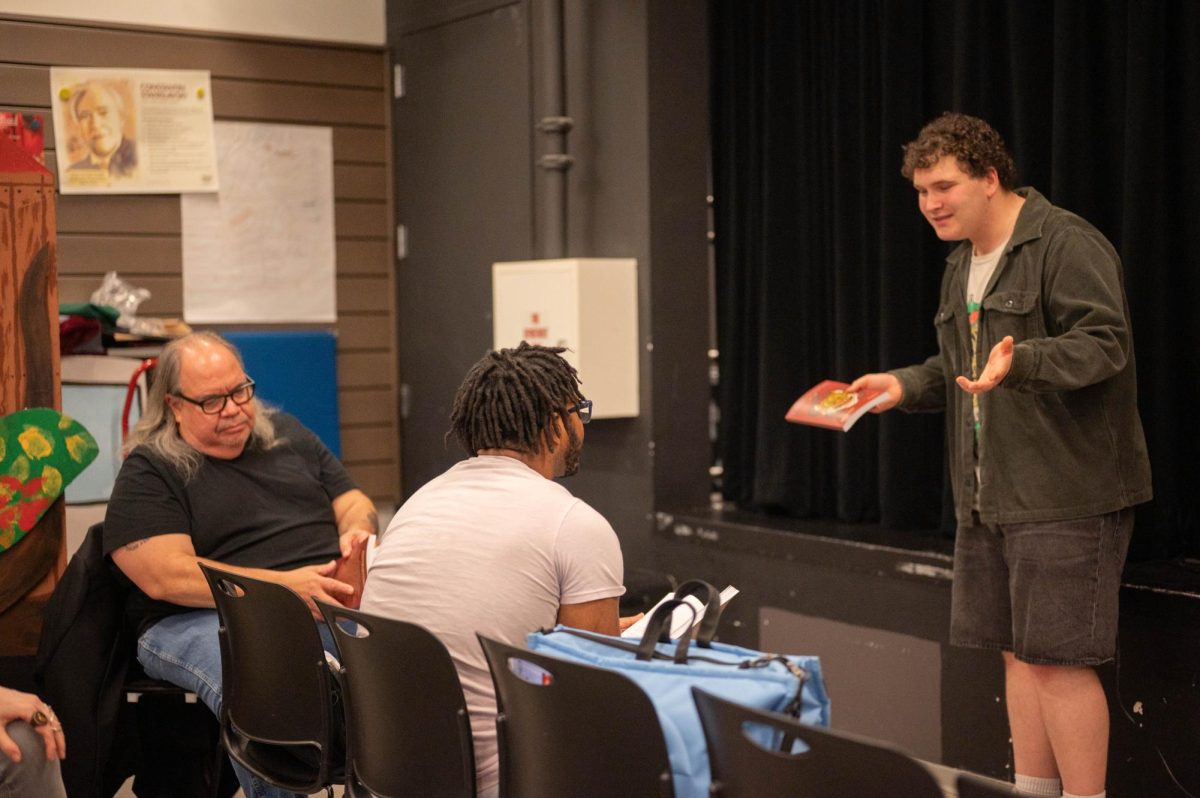 Junior Adam Tapper discusses student poetry with guest speakers, Mark Turcotte and Nile Lansana at this year's annual Poetry Fest on April 24. This year, 19 students performed poems alongside the two guest speakers.