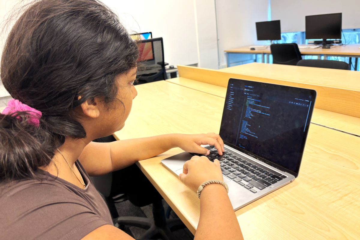 KEYBOARD OF INNOVATION. Junior Saanika Dutta uses a machine learning tool to work on adding new features to her app, Bias Lite. Saanika created the app to detect gender bias in text. 