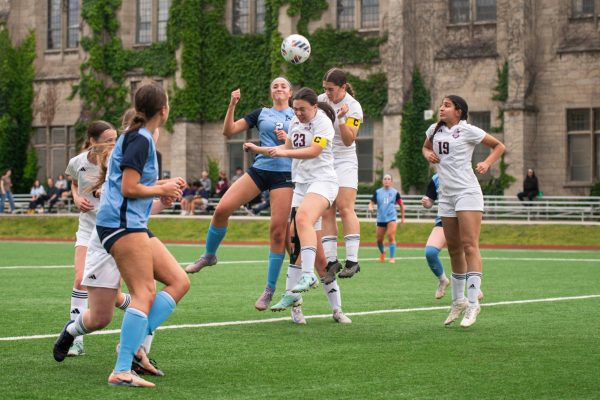 During the regional semi-final match against Nazareth Academy on May 19, seniors Devyn Moubayed and Leyla Yates jump to head the ball off a corner kick. U-High lost 2-0 to end the season.