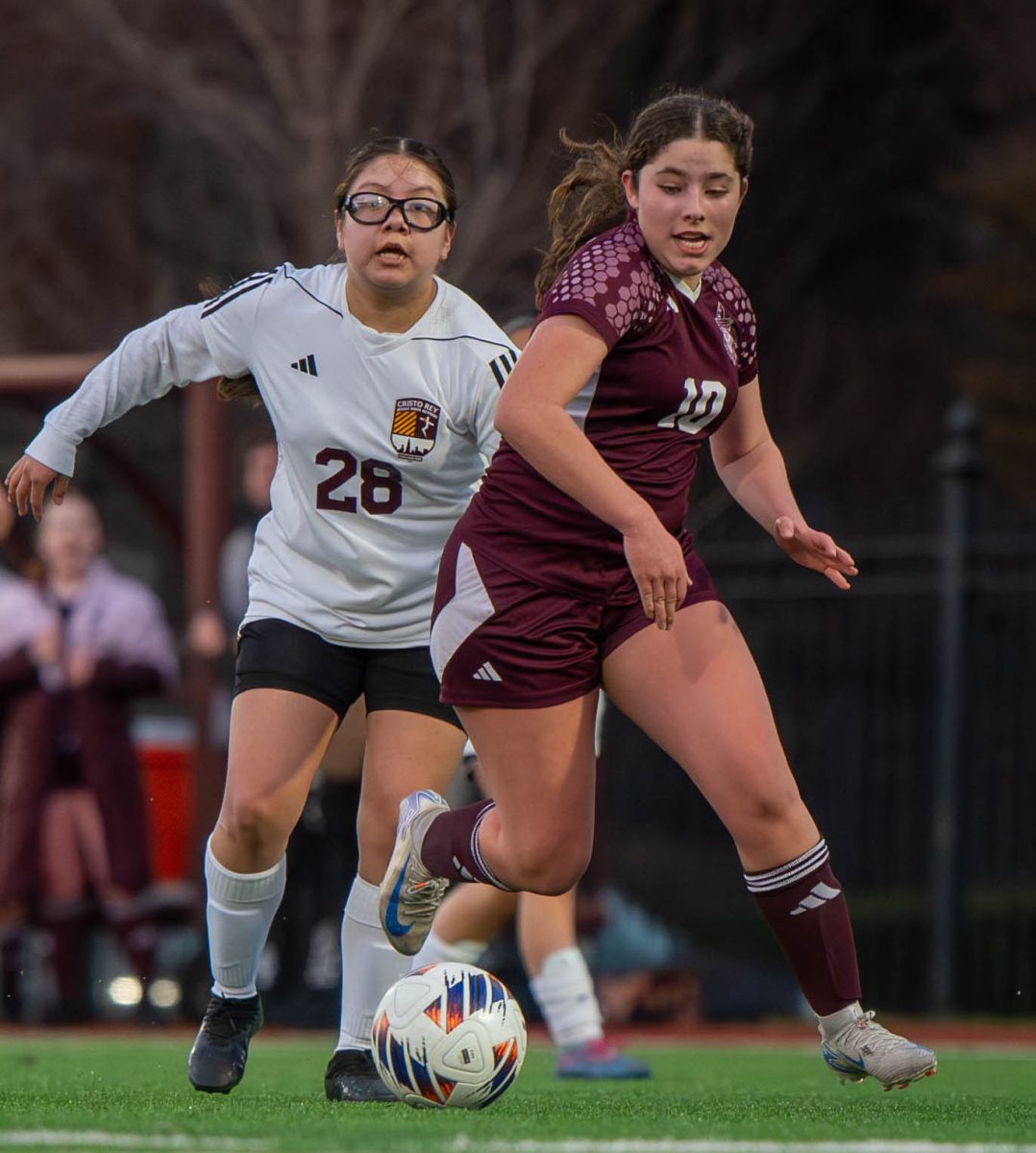 Junior Ana Rossi dribbles past a defender in a Maroon 5-1 win against Cristo Rey Jesuit on March 27. 