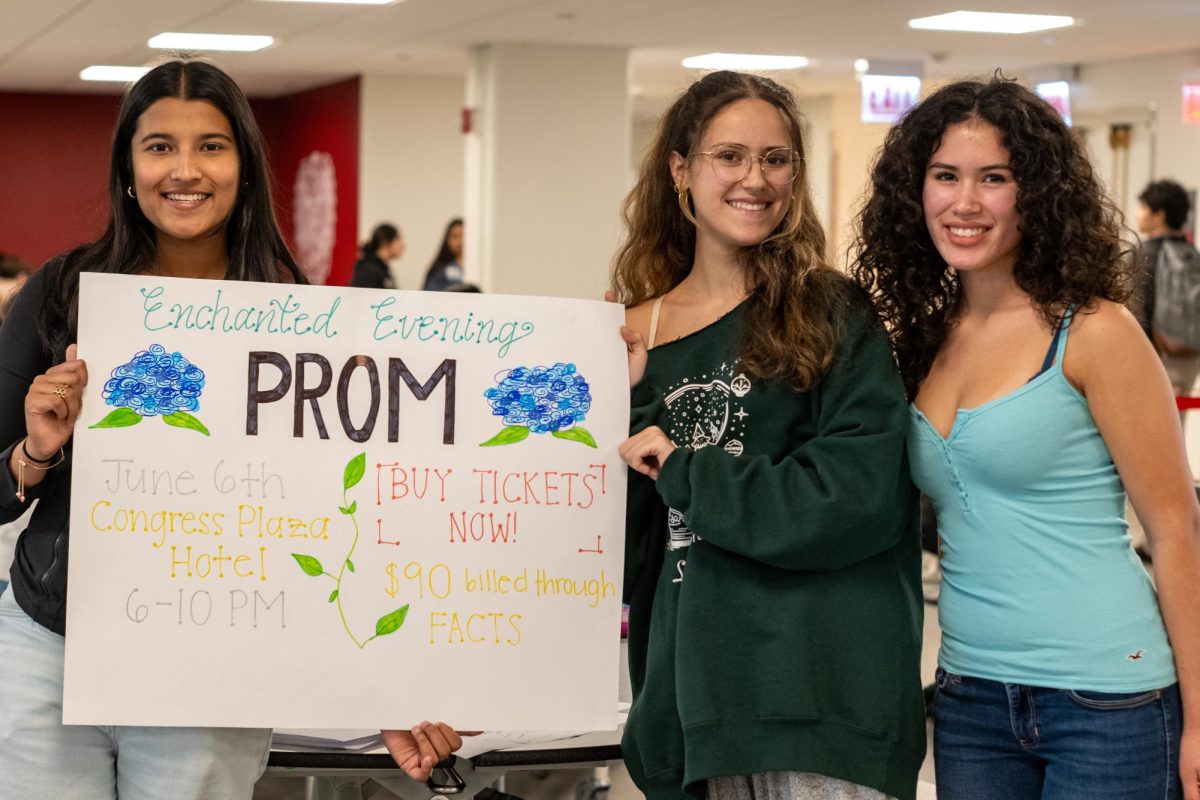 Seniors Vedika Dangi, Sofia Ybarra and Adelina Meija sell prom tickers during lunch in Café Lab. Tickets are being sold for $90. 
