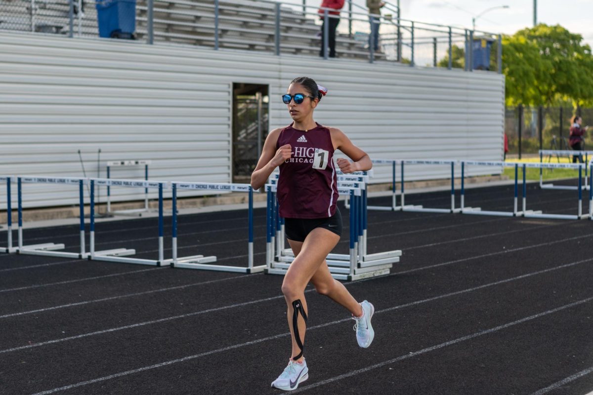 At the IHSA Class 2A sectional meet at South Shore International College Prep on May 14, junior Taara Sajdeh competes in the 1,600-meter run. Taara finished first with a time of 5:28.23, followed by junior Celia Lukas in second, both qualifying for state.