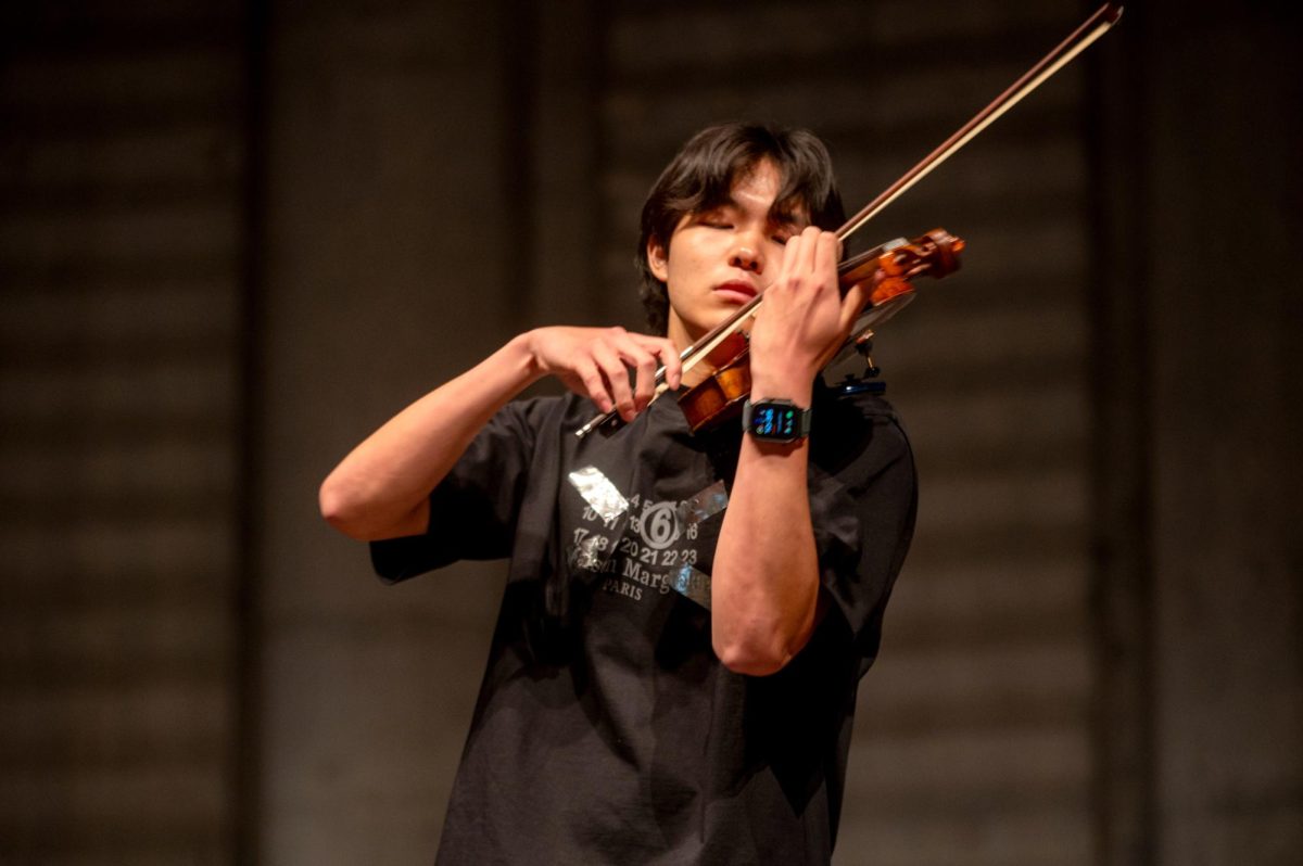 ANGELIC ARCO. Junior Aiden Yu performs on his violin during one of the awards assembly’s two musical interludes. Aiden performed parts of the piece “Le ronde des Lutins” by Italian composer Antonio Bazzini. Aiden later won the David Schuenemann Award for outstanding accomplishments in music, literature and science. 