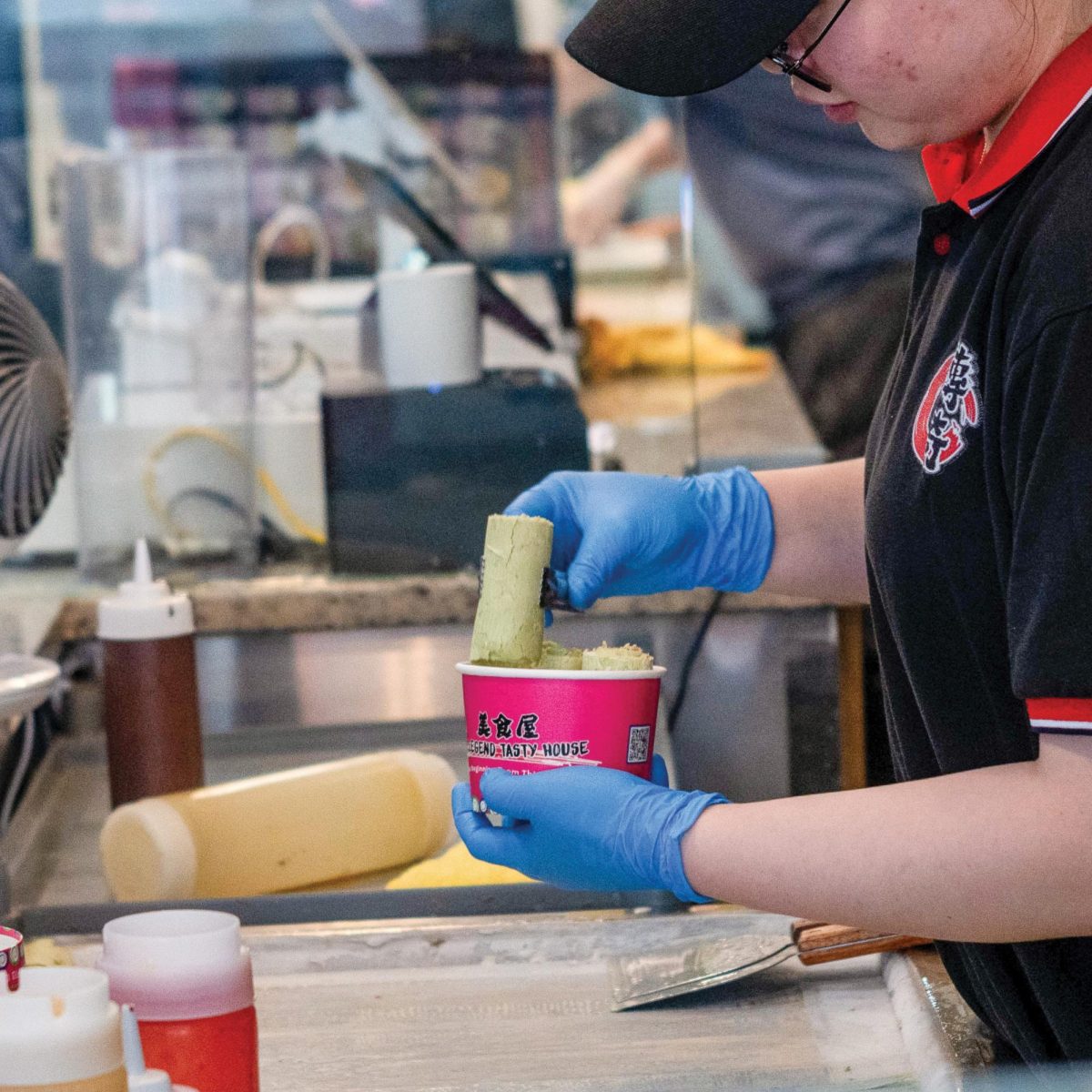 An employee rolls ice cream at  Legend Tasty House at 2242 S. Wentworth Ave. The restaurant specializes is a Thai-inspired rolled ice cream and is located in Chinatown. 